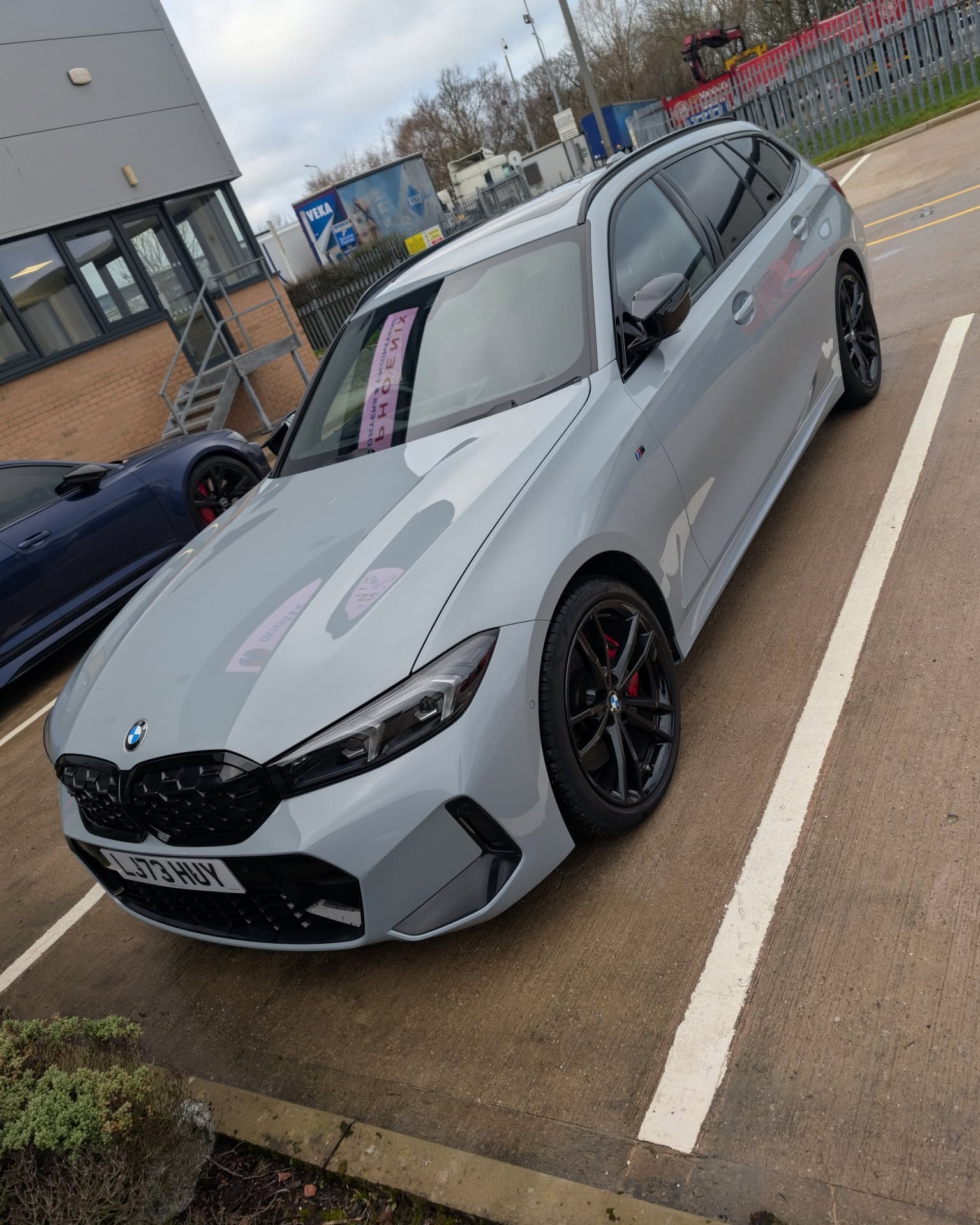 White BMW photographed outside